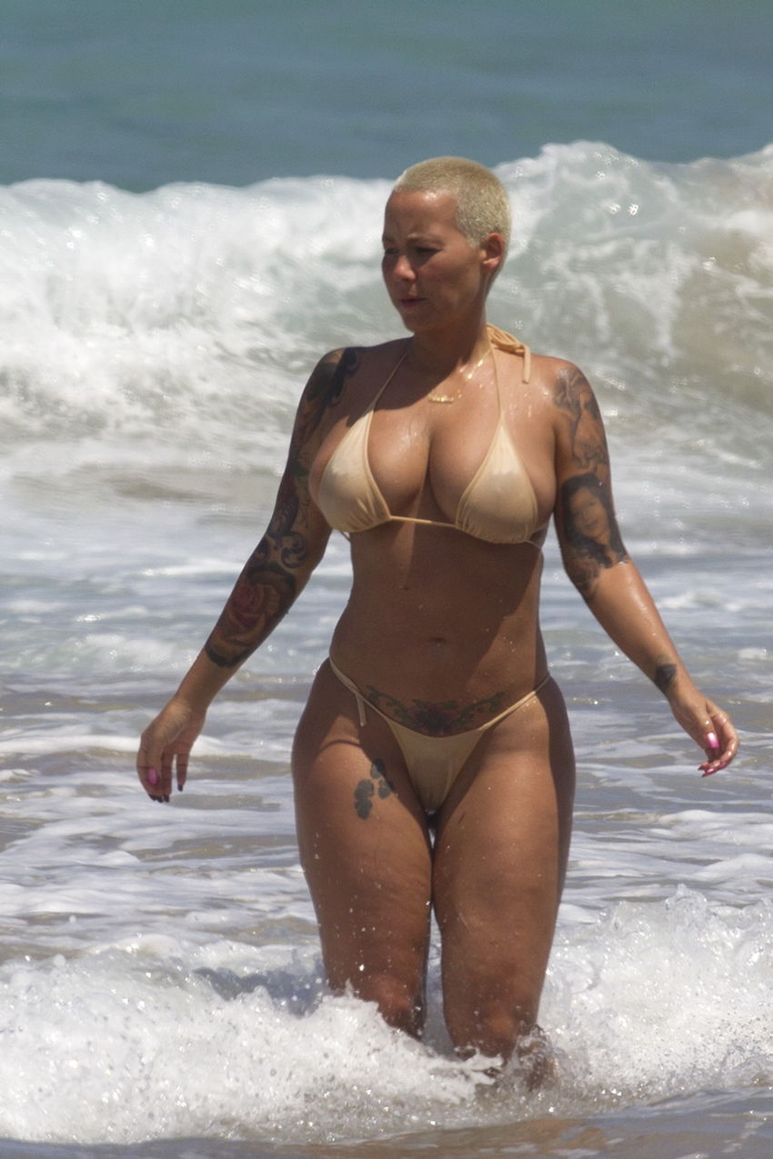EXCLUSIVE: Amber Rose spotted in a bikini with male friend in Hawaii